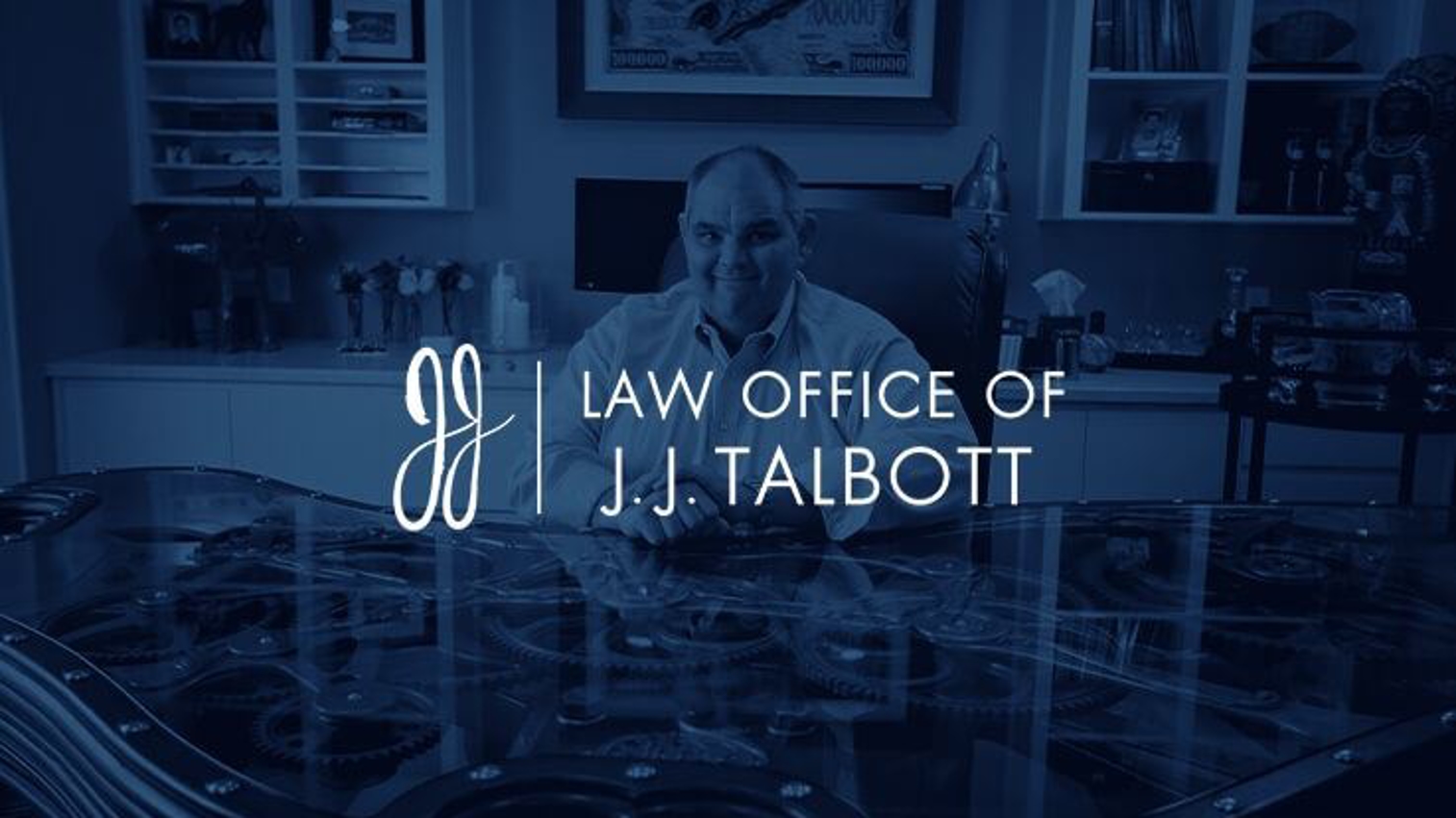 J.J. Talbot logo over desaturated office